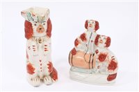 Lot 157 - Victorian Staffordshire spaniel group with one...