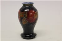 Lot 199 - Moorcroft miniature baluster vase in the...