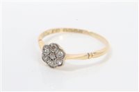 Lot 1238 - Gold (18ct) diamond flower-head cluster ring....