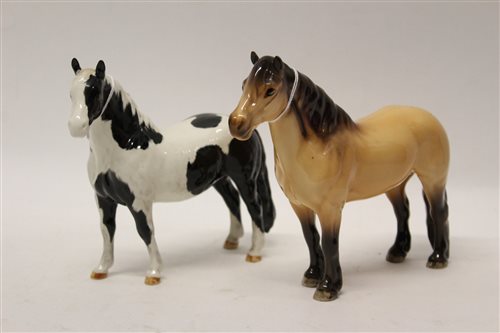 Lot 138 - Beswick Piebald pony and a Beswick Highland...