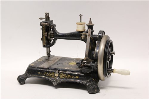 Lot 1721 - Victorian Empress sewing machine with mother...