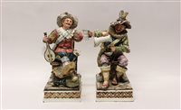 Lot 63 - Two large pottery figures of seated men...