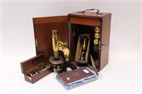 Lot 1599 - Late 19th century microscope with accessories...