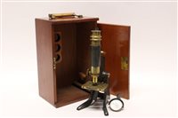 Lot 1504 - Lacquered brass microscope by Pictureskard,...