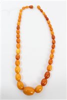 Lot 1293 - Old amber bead necklace with a string of...