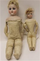 Lot 714 - Doll - small bisque head and shoulder doll -...