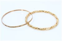 Lot 1257 - Gold (9ct) bangle and one other gold plated...