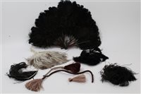 Lot 3092 - A curly black ostrich feather fan, some large...