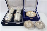 Lot 3744 - Four Indian silver / white metal beakers in...