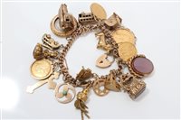 Lot 3288 - Gold (9ct) charm bracelet with a quantity of...