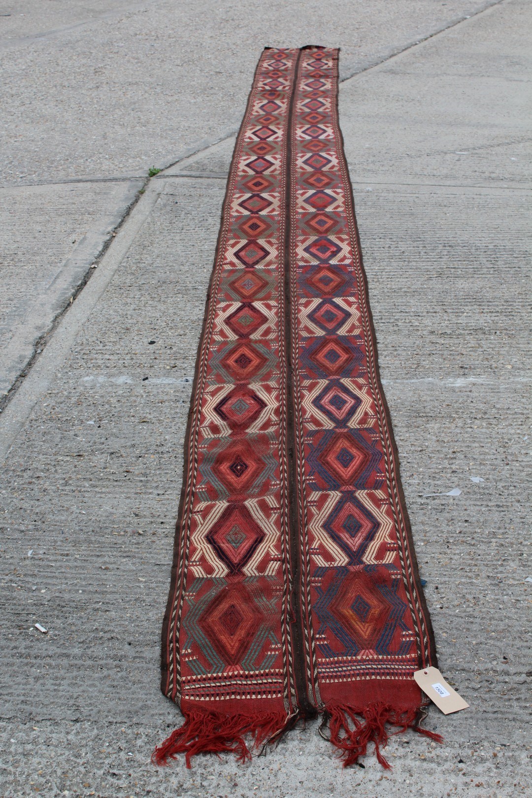 Lot 1508 - Unusual narrow Kelim-style runner with two