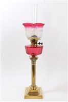 Lot 846 - Early 20th century oil lamp with etched ruby...