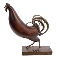 Lot 872 - Franz Hagenhauer: Carved wood and brass...