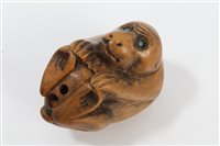 Lot 923 - Japanese carved boxwood netsuke modelled as a...