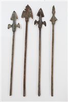 Lot 930 - Four antique Chinese bronze arrow-heads, the...