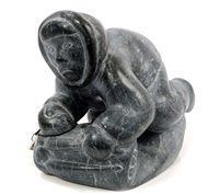 Lot 938 - Inuit stone carving dePicturesting an Eskimo...