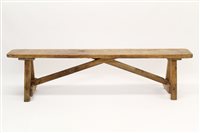 Lot 1331 - Antique pine bench raised on V-end supports...