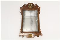 Lot 1344 - George II-style walnut fret carved wall mirror,...