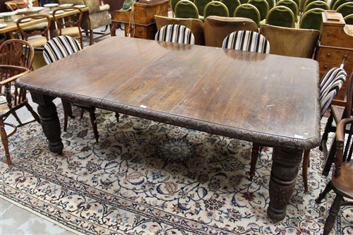 Lot 1408 - Victorian carved oak extending dining table,...