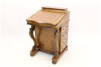 Lot 1457 - Victorian walnut davenport, serpentine-shaped...