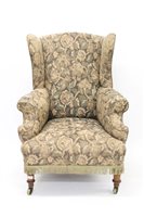 Lot 1467 - 19th century wing armchair raised on turned...