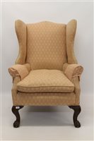 Lot 1480 - Early 20th century wing armchair, pink floral...