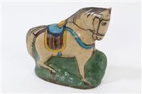 Lot 165 - Persian glazed pottery figure of a Qajar horse,...