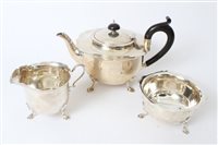 Lot 231 - 1920s silver three piece tea set - comprising...