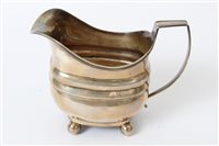 Lot 285 - George III silver cream jug of bellied form,...