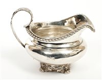 Lot 289 - George IV silver cream jug of compressed...