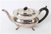 Lot 315 - George V silver teapot of compressed baluster...