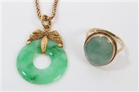 Lot 404 - Chinese green jade pendant with gold mounts,...