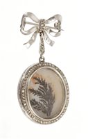 Lot 411 - Edwardian diamond set locket with an oval moss...