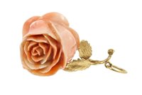 Lot 419 - Carved pink coral pendant in the form of a...