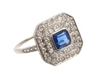 Lot 425 - Sapphire and diamond cluster ring with a...