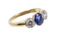 Lot 426 - Sapphire and diamond three stone ring with an...