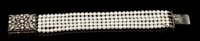 Lot 456 - Cultured pearl and diamond bracelet with five...