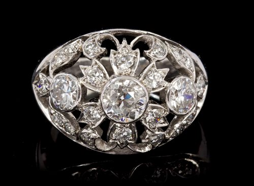 Lot 457 - Diamond cocktail ring of bombe form, with...