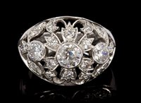 Lot 457 - Diamond cocktail ring of bombe form, with...