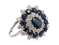 Lot 481 - Sapphire and diamond cluster ring, the oval...