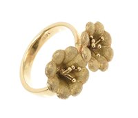 Lot 483 - Gold dress ring with two textured gold flowers...