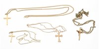 Lot 498 - Three 9ct gold cross pendants on chains and an...