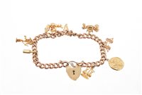 Lot 499 - Gold charm bracelet with various 9ct gold...