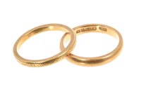 Lot 503 - Two 22ct gold wedding rings. Size P½