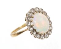 Lot 508 - Opal and diamond cluster ring, the oval opal...