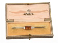 Lot 527 - Art Deco citrine and diamond bar brooch with a...