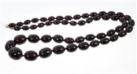 Lot 544 - Vintage simulated cherry amber graduated bead...