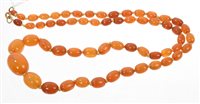 Lot 546 - Old amber necklace with a string of graduated...