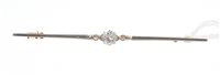 Lot 554 - Diamond bar brooch with an old cut diamond...