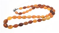 Lot 560 - Amber bead necklace with graduated amber beads,...